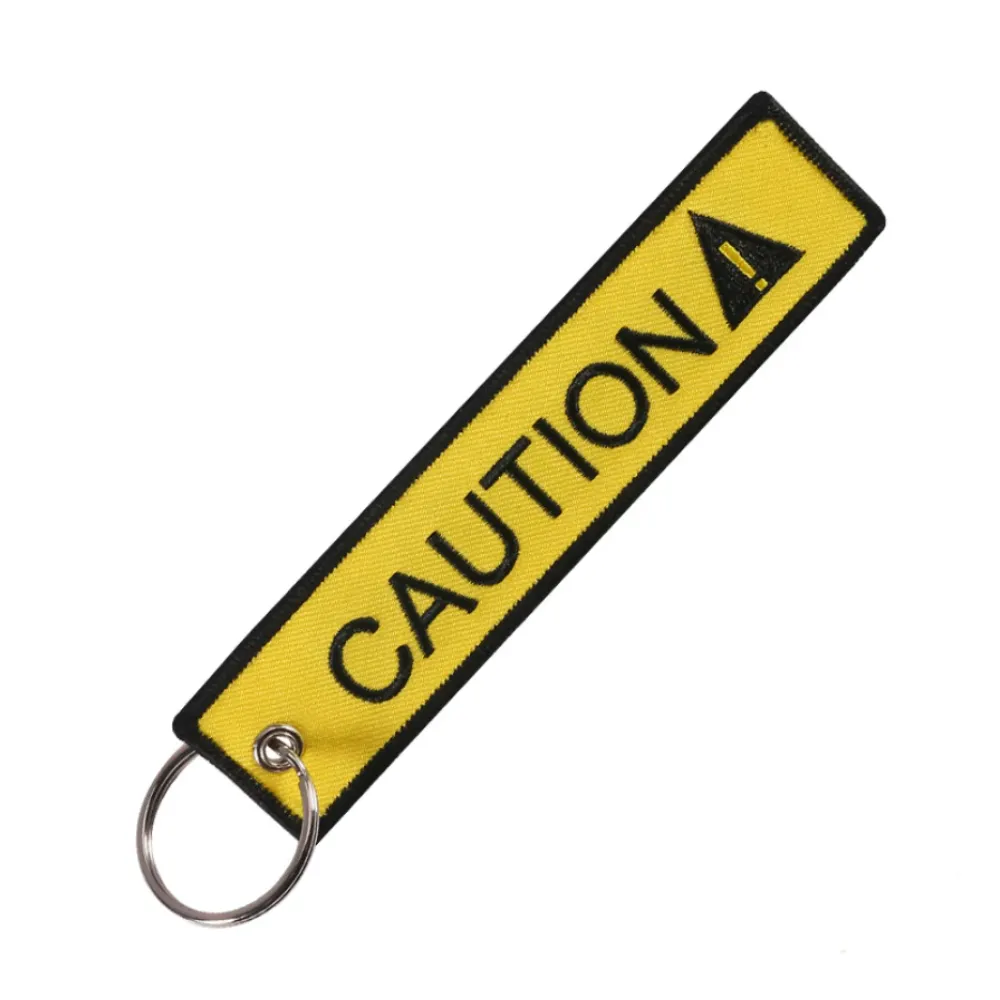 Llavero "Caution" Amarillo