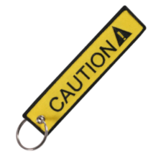 Llavero "Caution" Amarillo